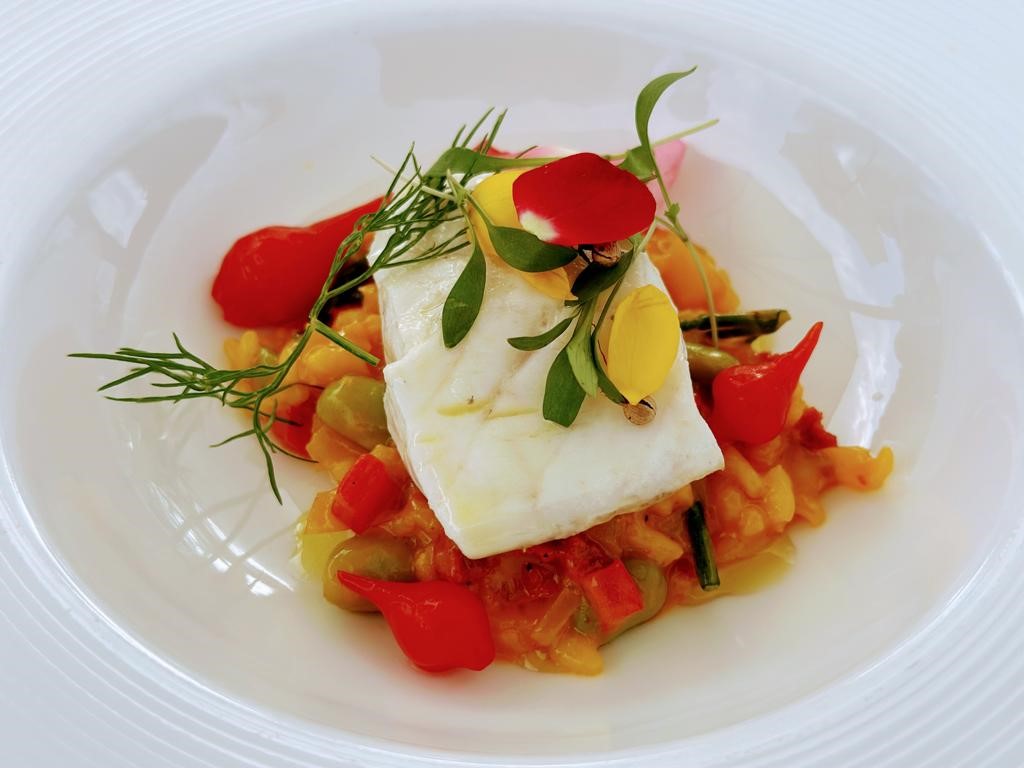 Köstliches Rezept für cremigen Reis mit Sobrasada und Wolfsbarsch, serviert im Grand Hotel Residencia*****GL